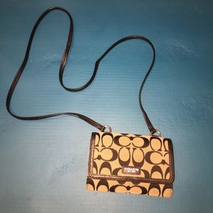 Black coach purse with snap buckle