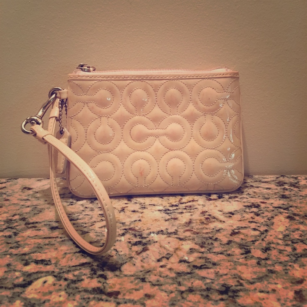 Cream Coach wristlet