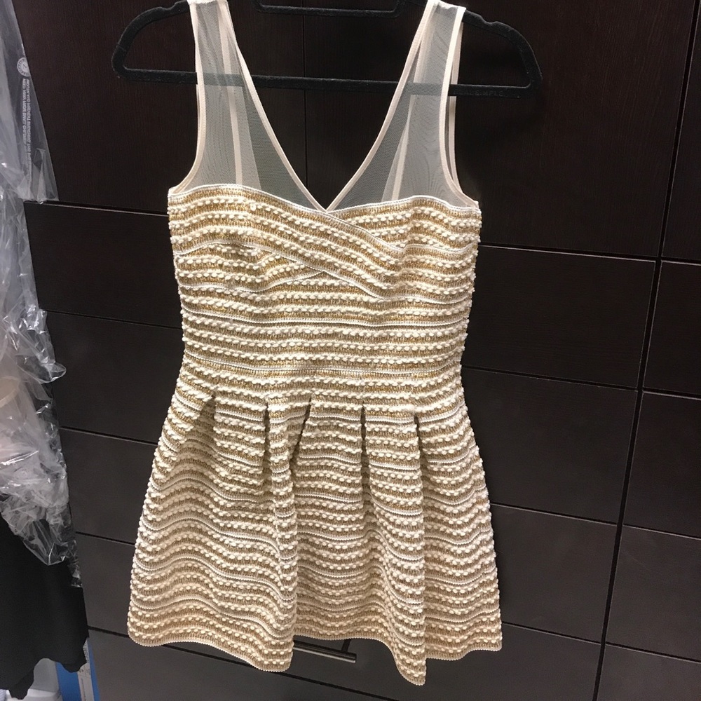 Gold and cream color dress
