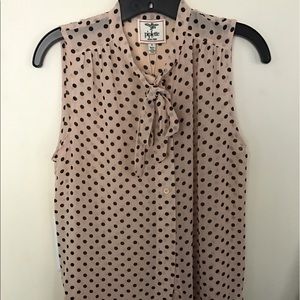 Polka dot sleeveless button down.