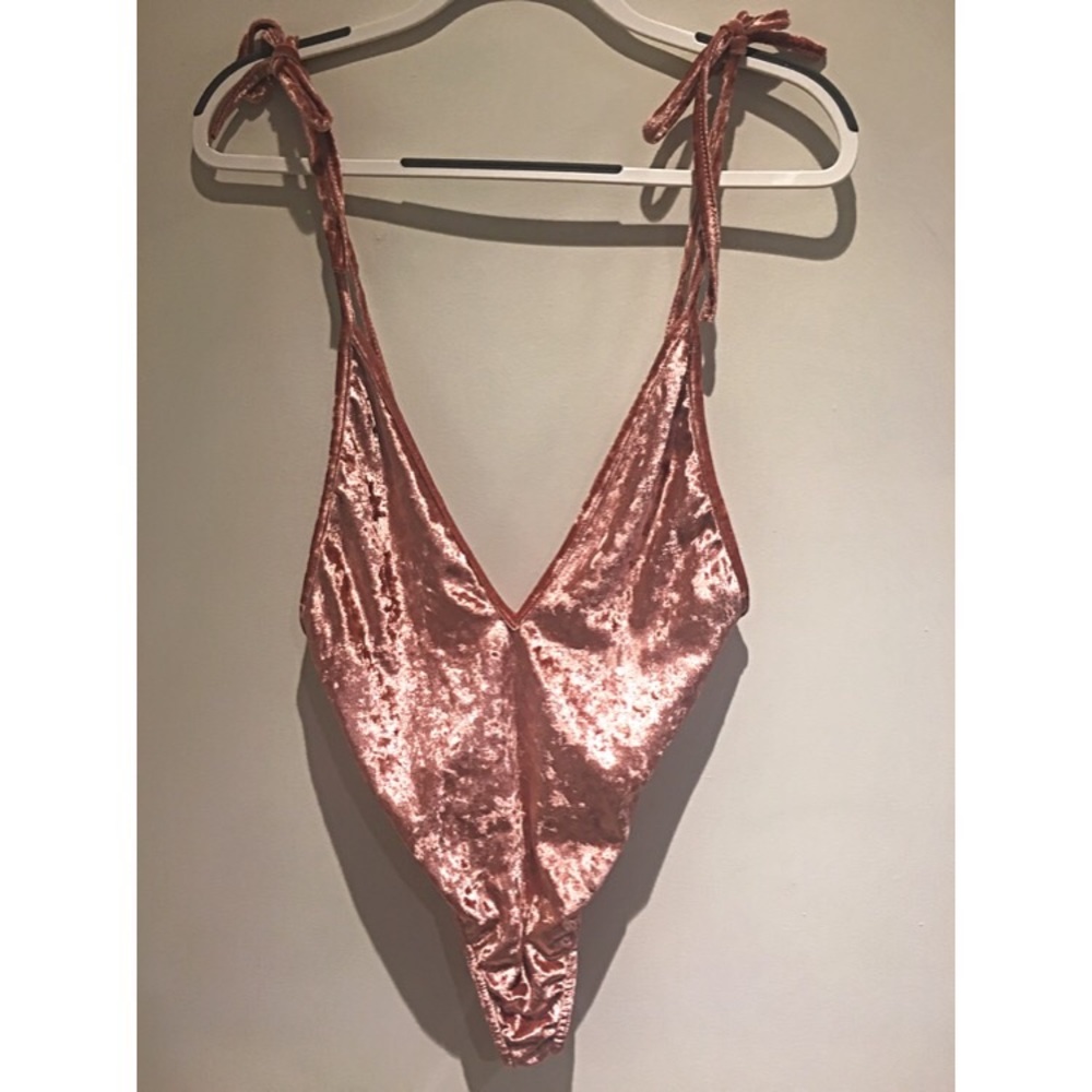 Backless, deep V-neck bodysuit