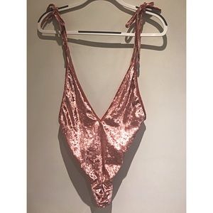 Backless, deep V-neck bodysuit