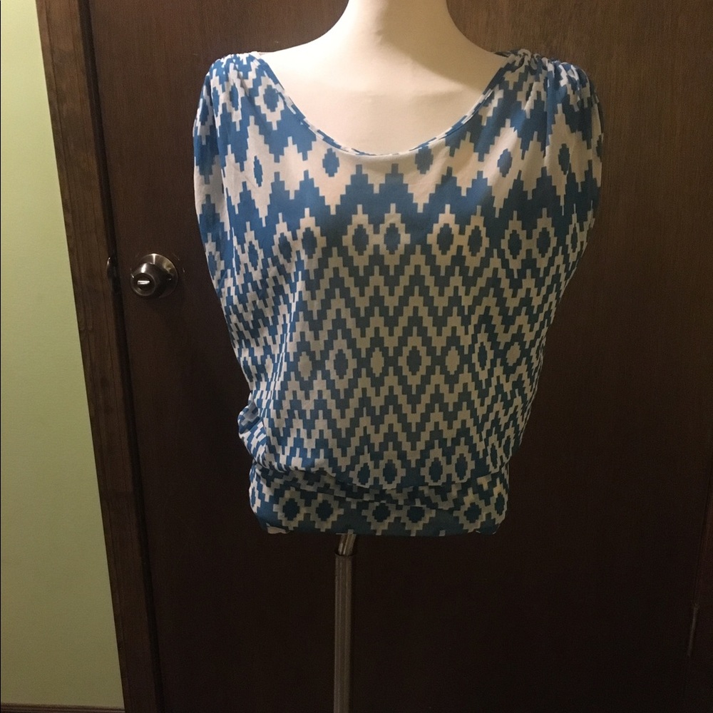 Sleeveless blue and white blouse