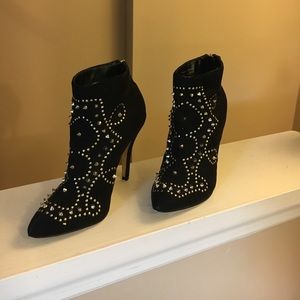 Black heel booties with gold studs