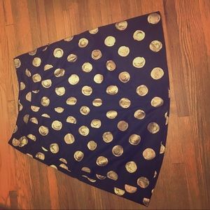 Tea length black skirt with gold polka dots