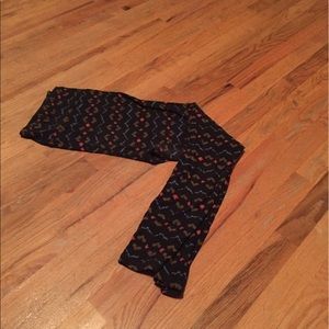 TC LuLaRoe leggings worn once black background