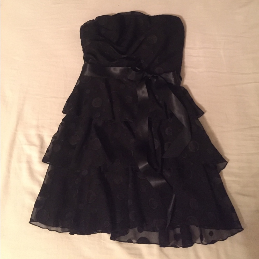 Black strapless dress with black polka dots