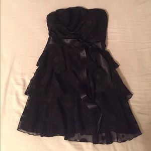 Black strapless dress with black polka dots