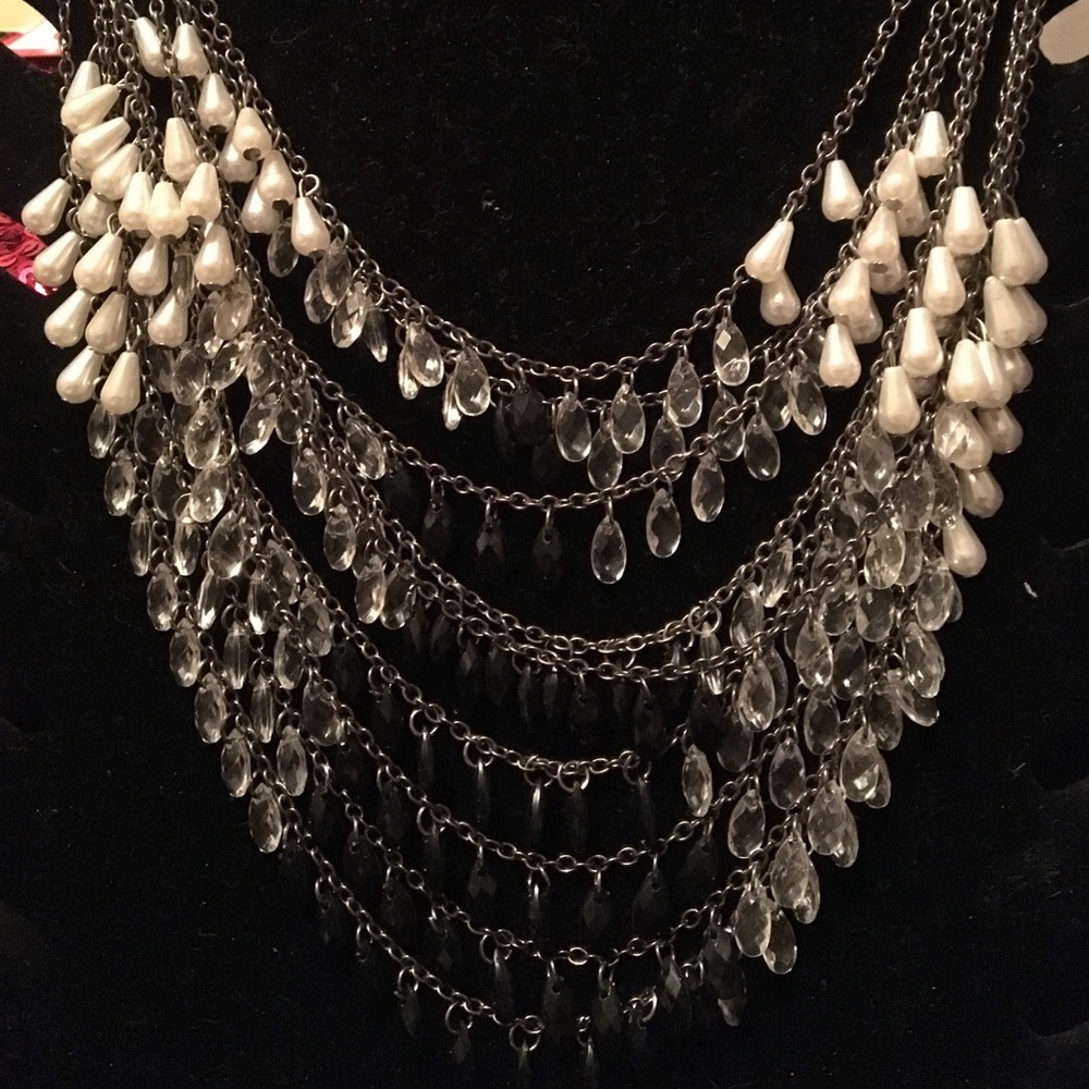 Med size- pearl color crystals and black stones.