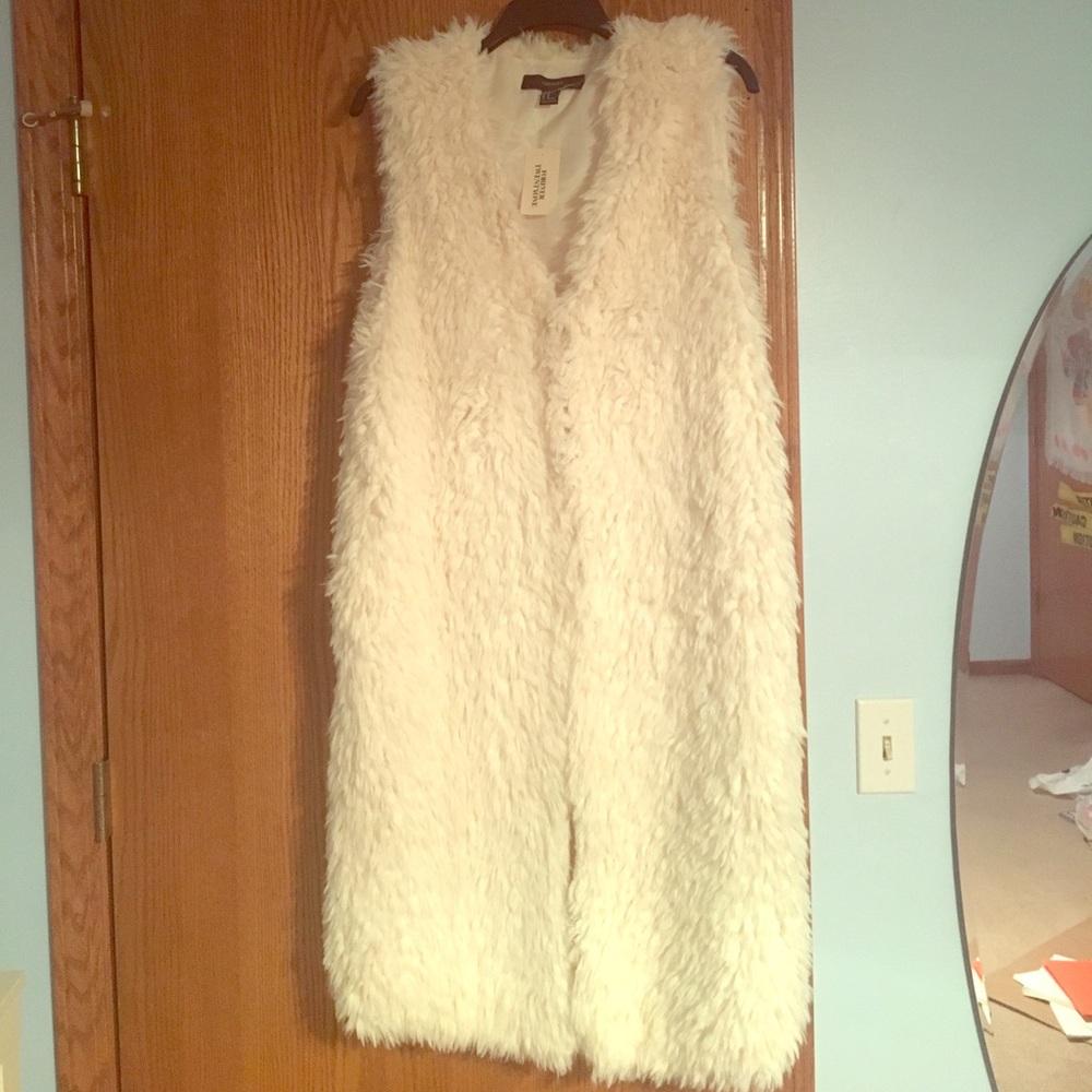 Cream faux fur vest.
