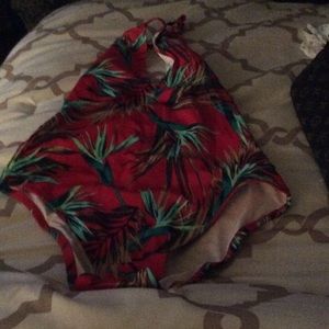 Pink one piece swimsuit, tropical print.