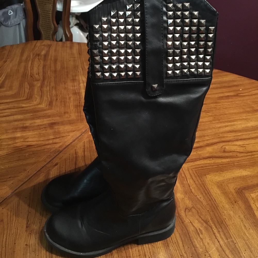Tall black leather boots with studs