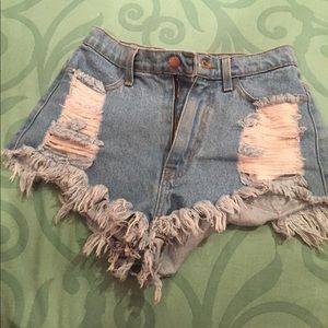 Distressed blue jean shorts