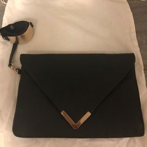 Wristlet clutch black and gold