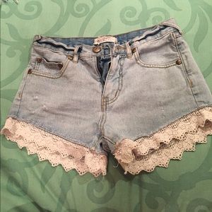 Blue jean shorts with lace on the bottom free ppl