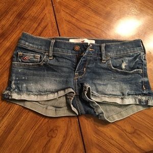 Medium wash distressed denim shorts