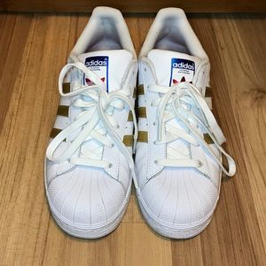 Adias white and gold super star shoes