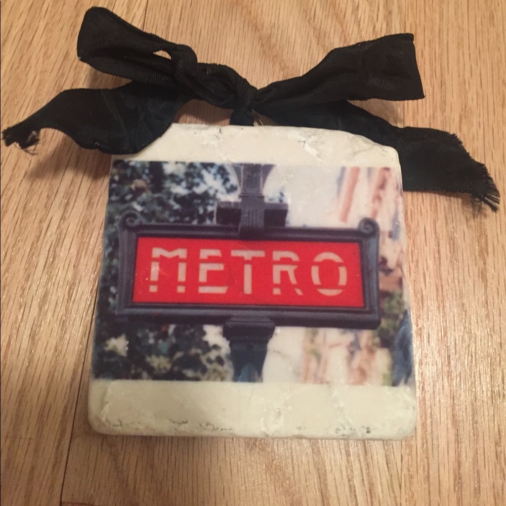 Polished tile with Paris Metro sign