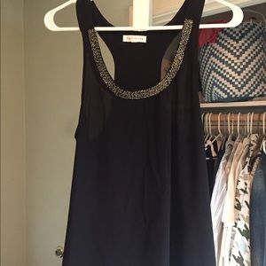 Black embellished razorback tank top.
