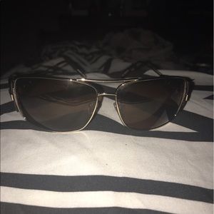 Brown Sunglasses with gold frame.