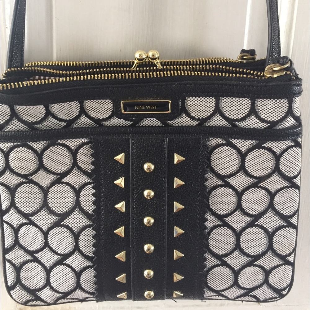 Crossbody bag with gold detailing.