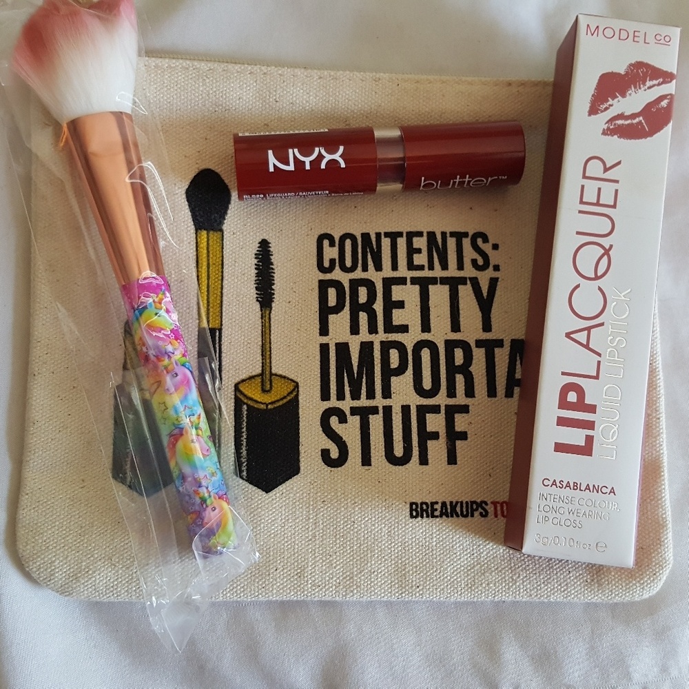 Ipsy bag, liquid lipstick, lip butter, blush brush