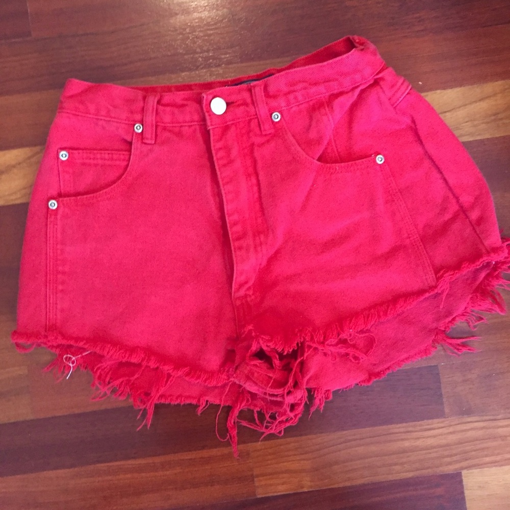 Red high waisted shorts. Frayed denim.