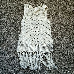 A fringe knit vest