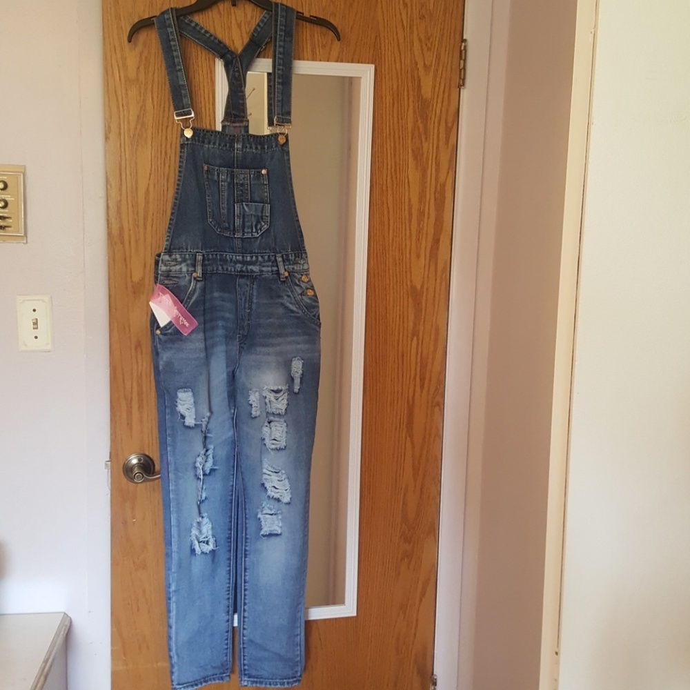 Ripped jean overalls