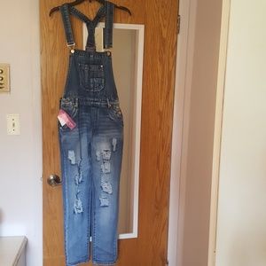 Ripped jean overalls