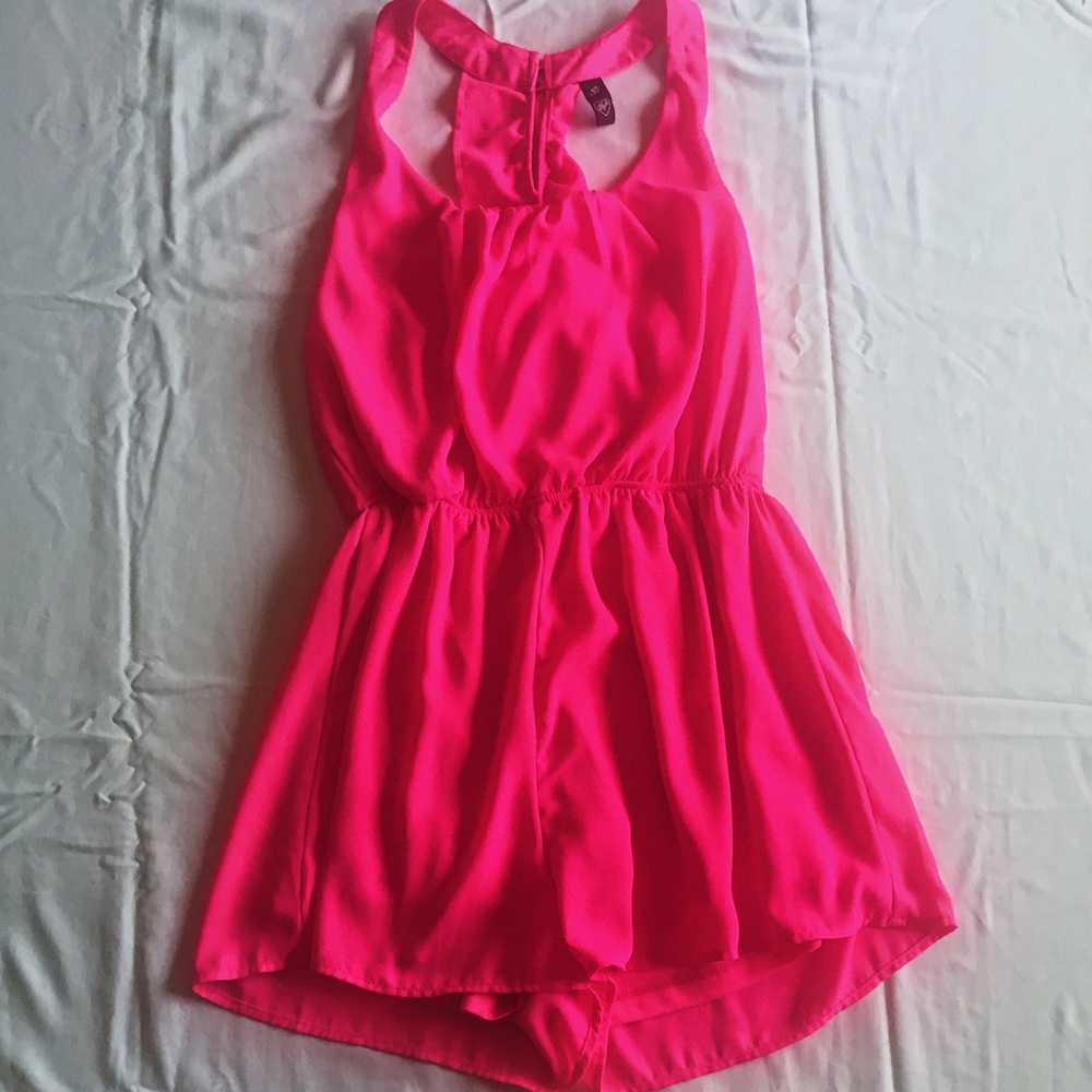 Bright pink romper with pretty detailed back
