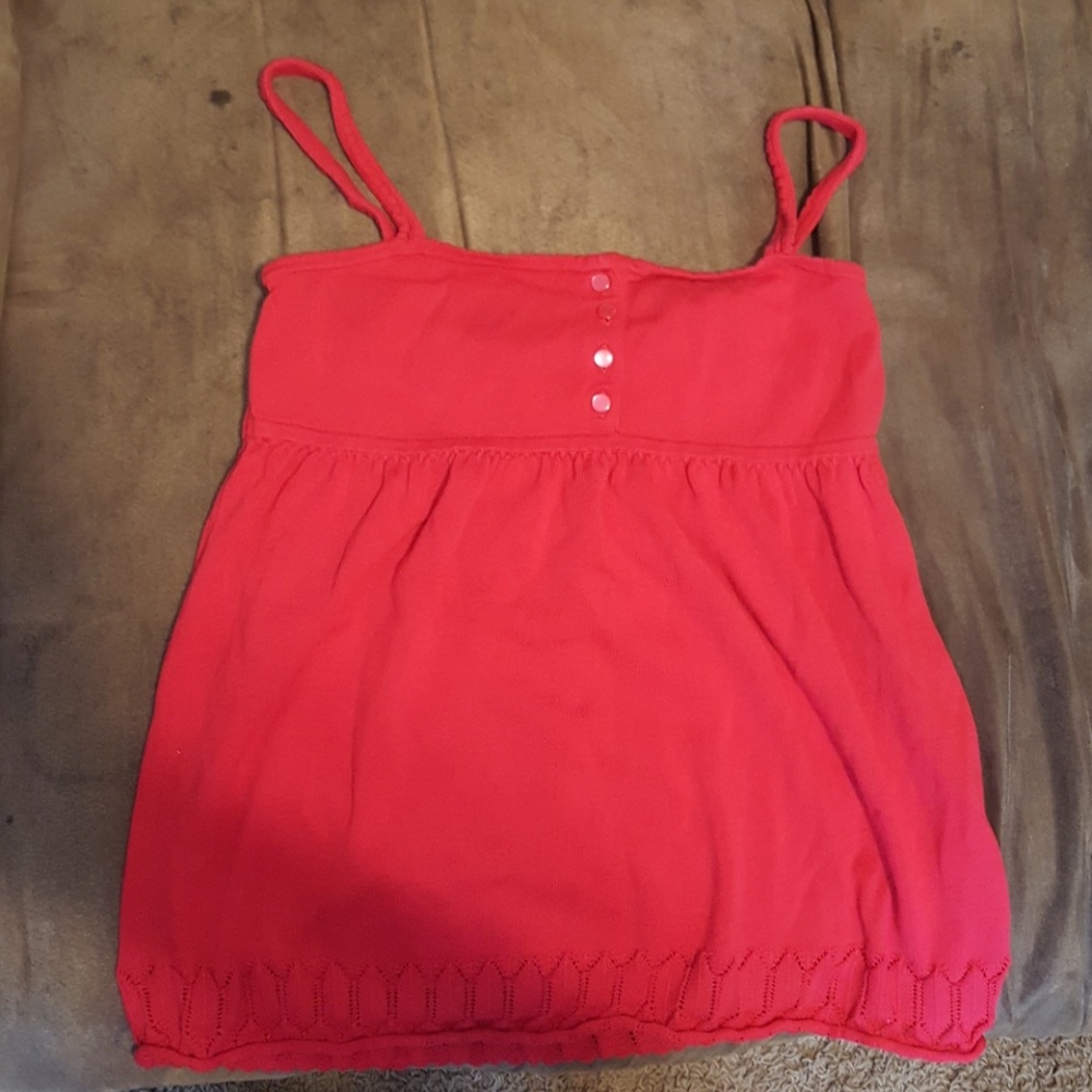 Women's red sleveless light summer sweater top.