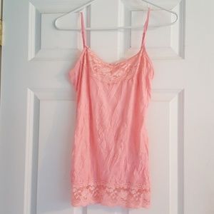 Peach colored Maurice spaghetti strap tank.