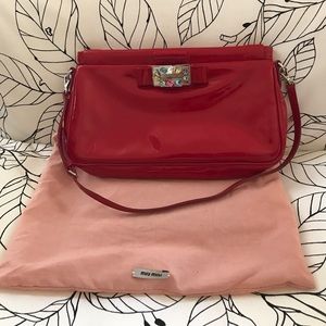 Miu Miu jeweled clutch in red patent leather