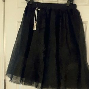 Black tulle skirt/ NWT. fits. size 12/14