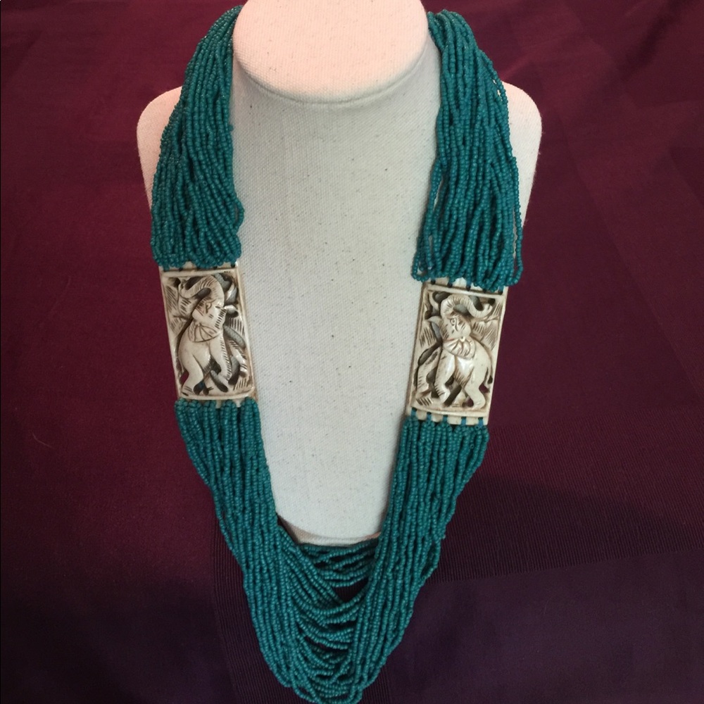 NWOT. Beaded necklace with hints of turquoise