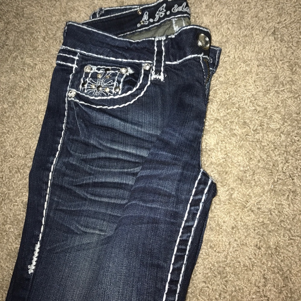 Dark wash jeans with gems. Like new.