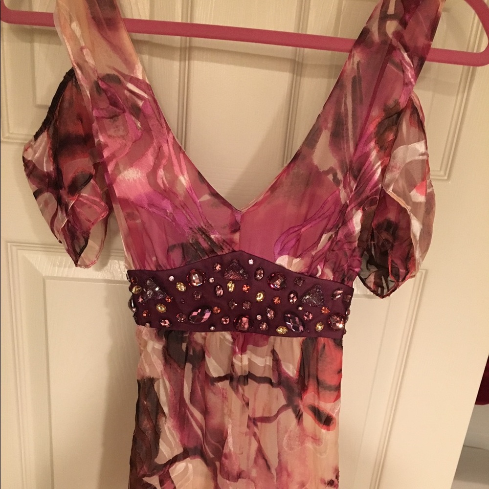 Long style blouse with faceted gem stones.