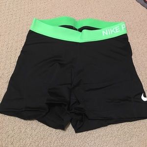 Black Nike pro spandex with lime green band