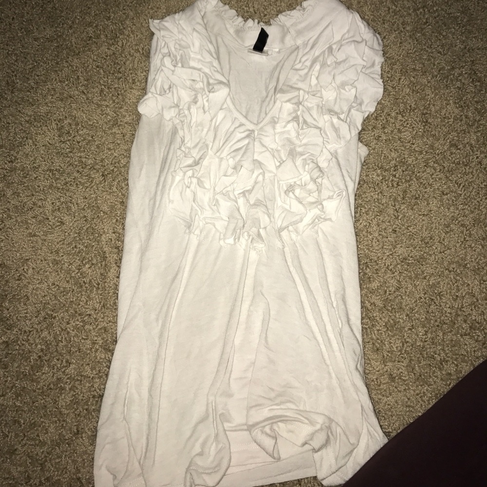 Adorable white ruffle tank.Sorry for the wrinkles!