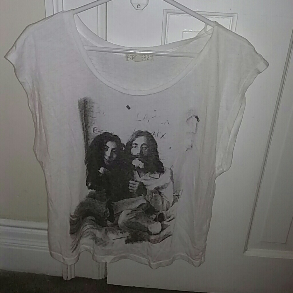 John & Yoko sleeveless white shirt.