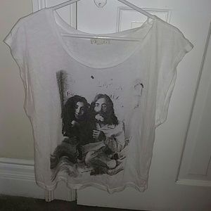 John & Yoko sleeveless white shirt.