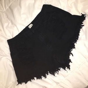 Black high waisted fringed shorts