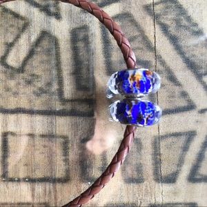 Two Pandora glass beads