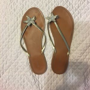 Gold starfish flip flops