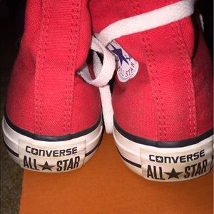 Red converse high top sneakers