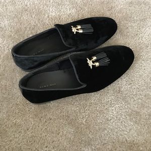 Black velvet loafers with tassels