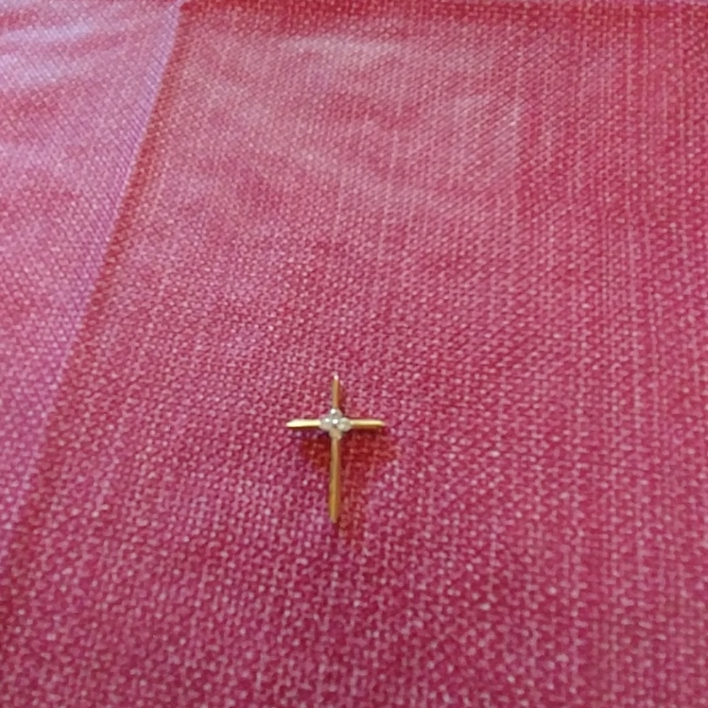 14 k gold cross with diamonds.
