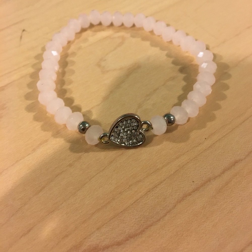 Brand new pink beaded bracelet with heart