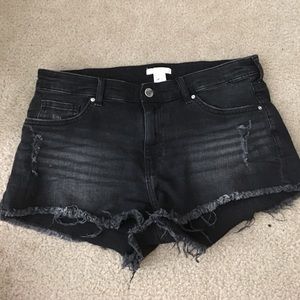 Low rise, black distressed denim shorts